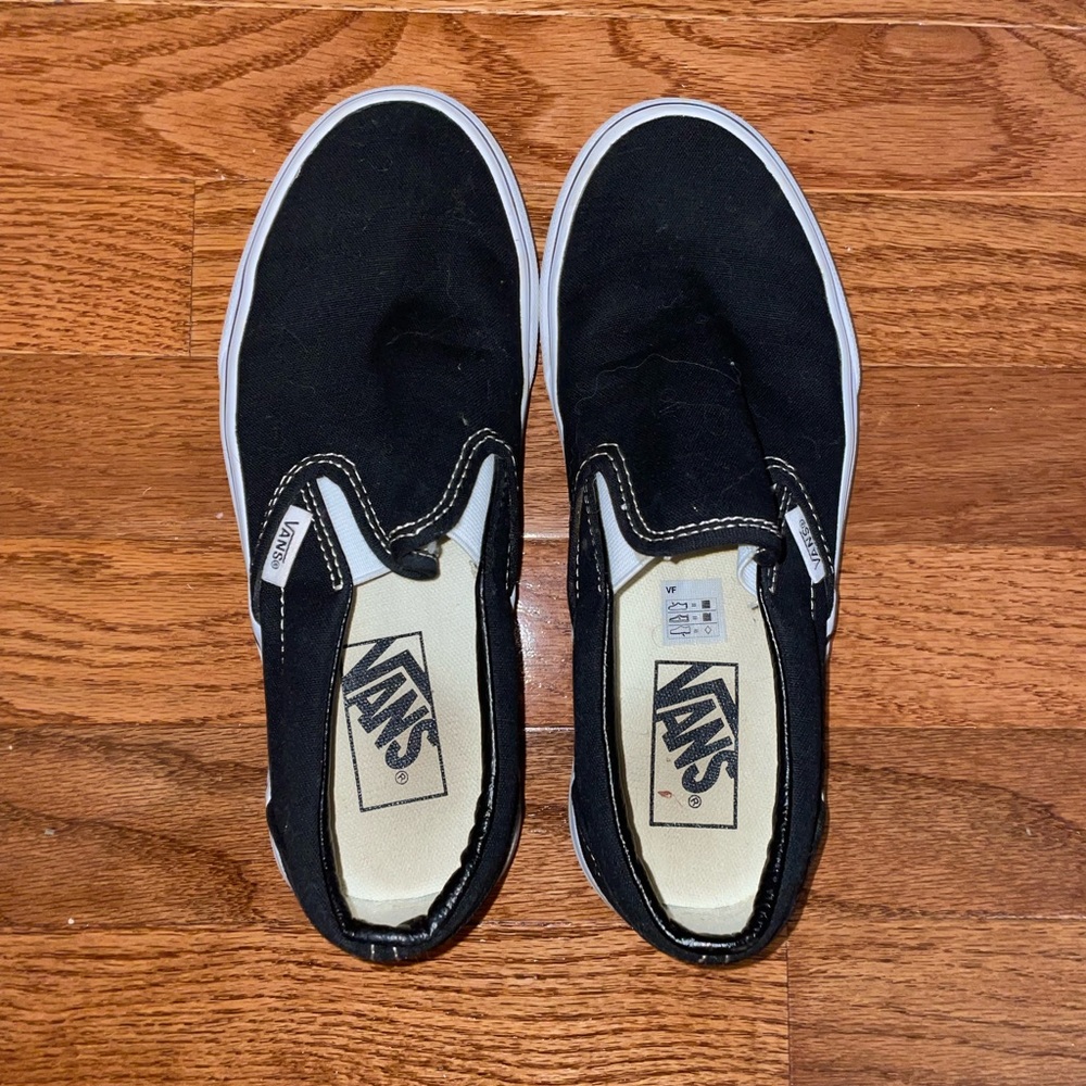 Vans black slip-ons